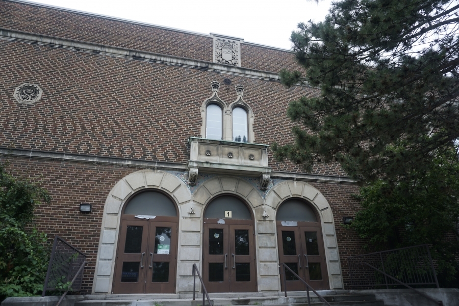 The current Institute's Romanesque-style main entrance.